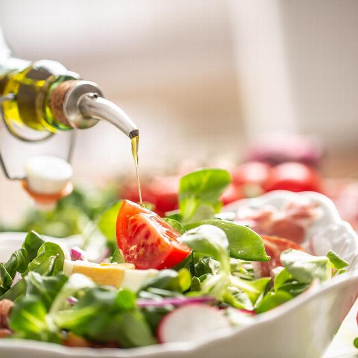 Oil being drizzled on salad